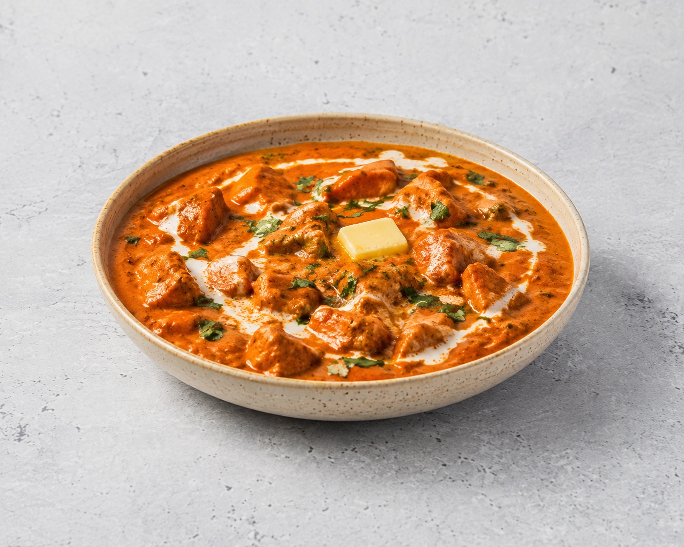 Butter Chicken curry served with jeera rice, salad and papad