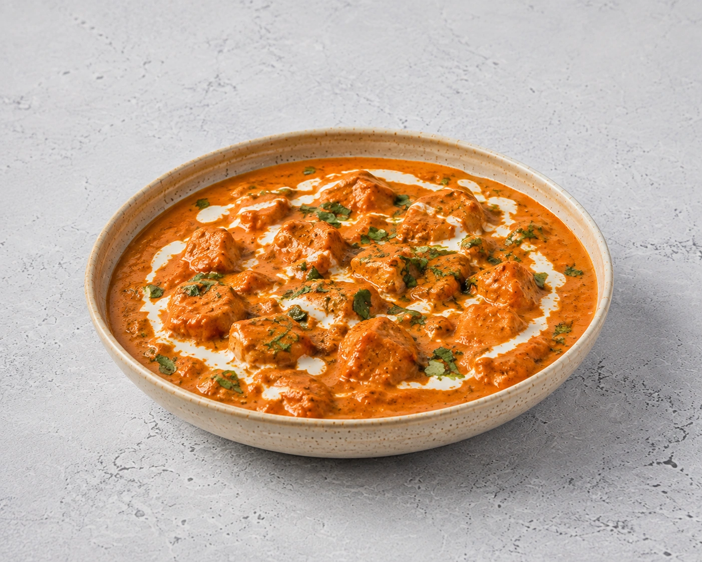 Tikka Masala curry served with jeera rice, salad and papad