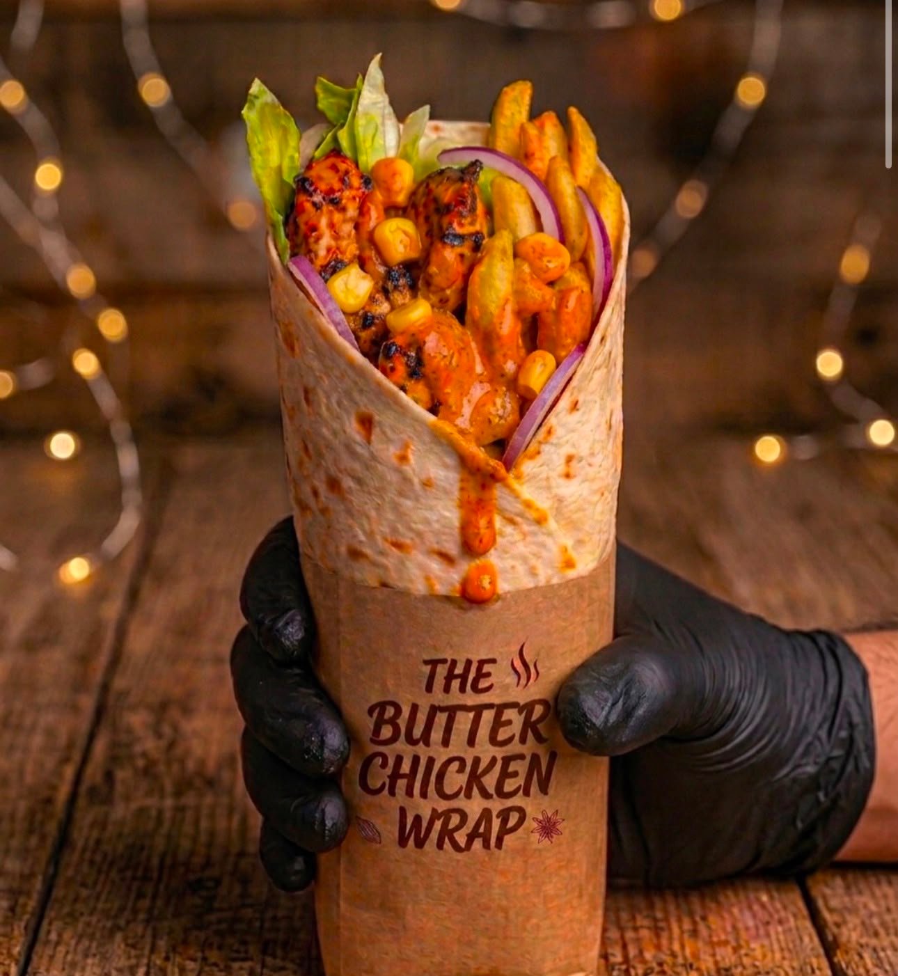 The Butter Chicken Wrap held fresh off the Miss India Oslo grill