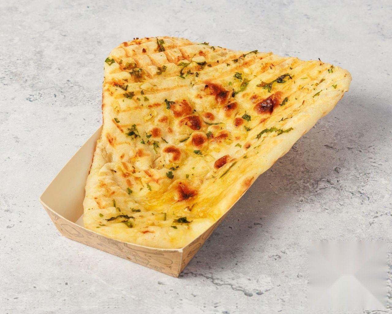 Garlic Naan brushed with garlic butter and coriander
