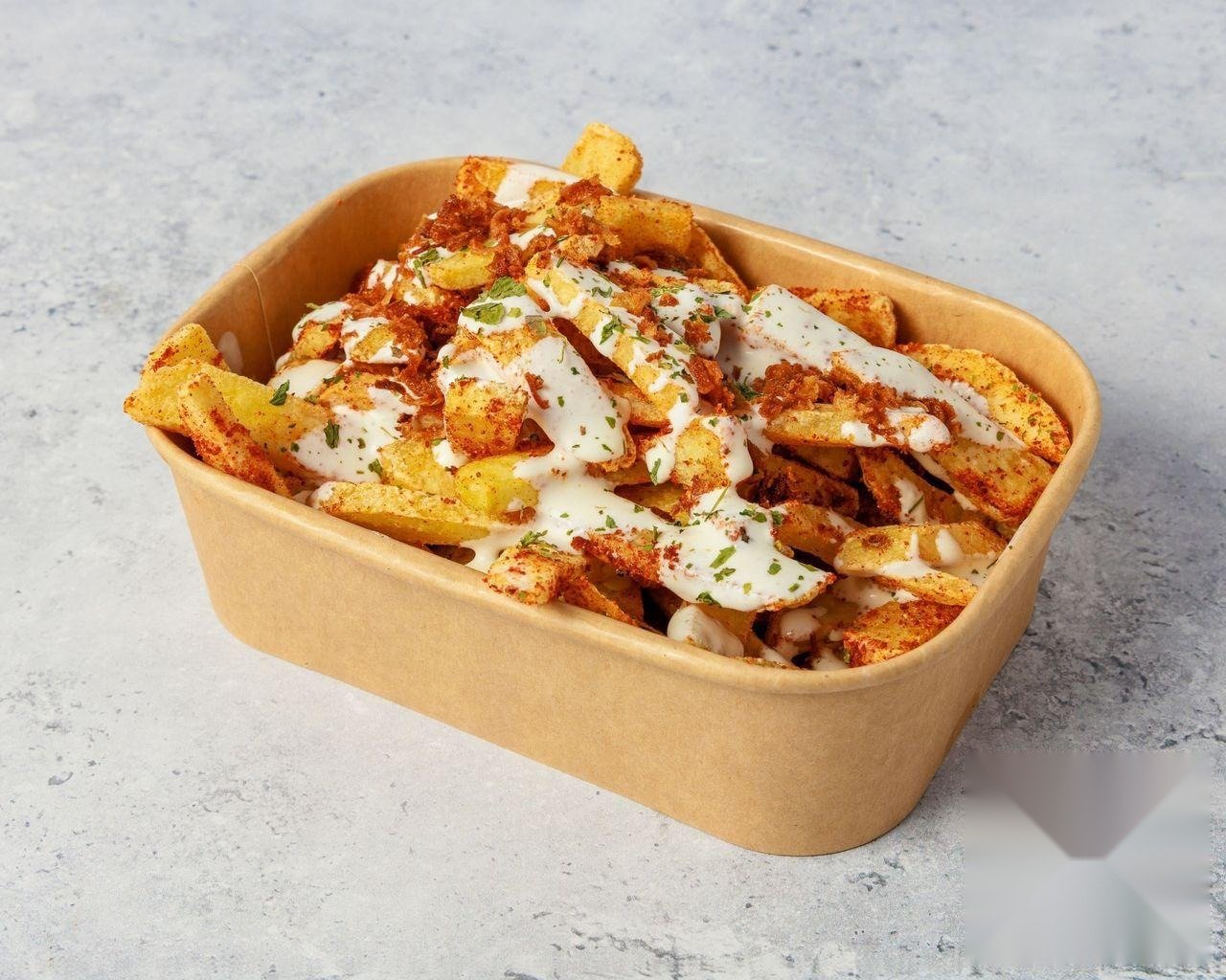 Desi Loaded Fries topped with grilled chicken tikka and rich tikka sauce